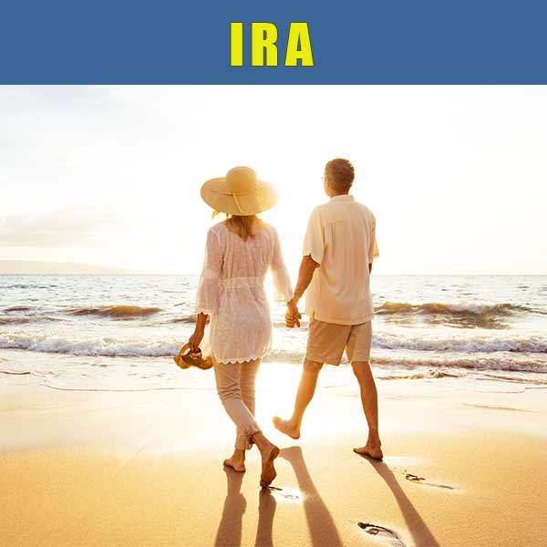 Middle aged couple holding hands on the beach