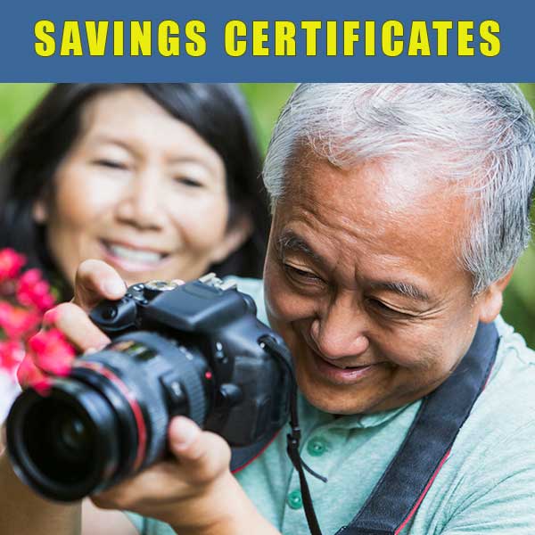 Mature couple enjoying taking outdoor photos