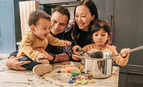 Happy family enjoying cooking time together.