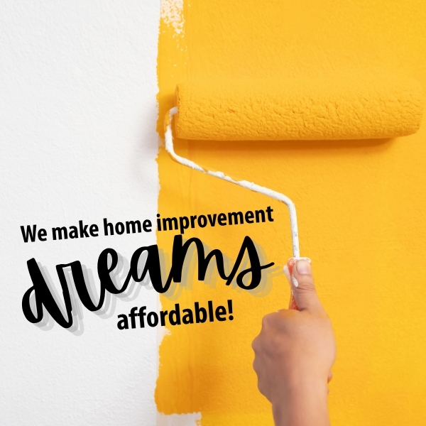 Painting a wall orange with a roller.